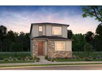 Two-story home with stone accents and landscaped front yard at 6310 N Malaya St, Aurora, CO 80019