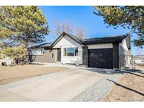 Charming remodeled single-story home with a new driveway and a two-car garage at 8348 Cherokee St, Denver, CO 80221
