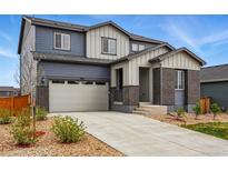 Beautiful two-story home featuring a two-car garage, brick accents, and a manicured front yard at 11744 Magnolia Dr, Thornton, CO 80233