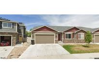 Charming single-Gathering home with a well-maintained front yard and attached two-car garage at 11129 Paradise Ln, Firestone, CO 80504