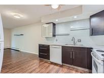 Modern kitchen with stainless steel appliances and beautiful backsplash at 13691 E Marina Dr # 107, Aurora, CO 80014