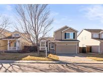 Charming two-story home with a well-maintained lawn and inviting curb appeal on a sunny day at 5285 S Jericho Way, Centennial, CO 80015