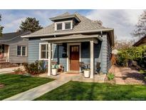 Charming single-Gathering home showcasing a quaint front porch and well-manicured lawn at 3052 S Cherokee St, Englewood, CO 80110