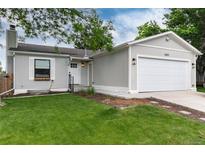 Charming single-Gathering home with a well-maintained lawn and attached garage at 4800 S Tabor St, Morrison, CO 80465