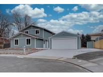 Charming two-story home with a detached two-car garage, new landscaping, and a spacious driveway at 9416 Lamar St, Westminster, CO 80031
