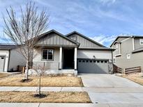 Charming single-Gathering home with a two-car garage and low-maintenance front yard at 18129 E 99 Pl, Commerce City, CO 80022