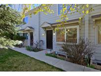 Charming two-story townhouse with manicured lawn, covered entry, and bright, sunlit windows at 3580 Broadway St # 3, Boulder, CO 80304