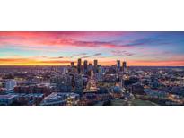 Stunning aerial view of Denver skyline at sunset at 6958 Brentwood Ct, Arvada, CO 80004