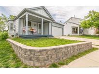 Charming single-Gathering home with a two-car garage and a well-maintained lawn and covered front porch at 462 Chelan St, Golden, CO 80401