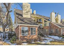 Brick townhouse exterior with stairs and landscaping at 13791 E Lehigh Ave # A, Aurora, CO 80014