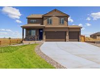 Beautiful two-story home featuring a three-car garage and meticulous landscaping at 250 Chardon Ave, Brighton, CO 80601