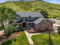 Stunning two-story home featuring beautiful landscaping and mountain views at 188 S Rogers Way, Golden, CO 80401