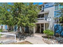 Charming condo with trees and a nice walkway leading to the front door at 19192 E Wyoming Pl # 206, Aurora, CO 80017