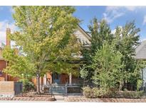 Charming two-story home with a brick facade and porch at 2771 W 38Th Ave, Denver, CO 80211