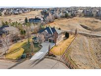 Stunning two-story home showcasing meticulous landscaping and a private lot in a desirable community at 14958 Wistera Way, Broomfield, CO 80023