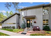 Charming gray two-story home with landscaped yard and welcoming entrance at 2356 Hiwan Dr # 40, Evergreen, CO 80439