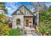 Charming home with a manicured front yard and inviting front porch at 671 Elati St, Denver, CO 80204