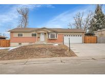 Charming single Gathering home featuring a well-manicured yard and a spacious two-car garage at 12022 W Dakota Dr, Lakewood, CO 80228