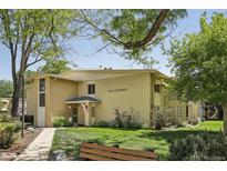 Charming home exterior featuring a well-manicured lawn, mature trees, and visible address at 625 S Clinton St # 7A, Denver, CO 80247