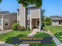Charming townhome with well-manicured lawn and inviting front porch at 4691 S Fraser Cir # A, Aurora, CO 80015
