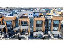 Modern townhouse complex featuring private rooftop terraces and stylish architectural details at 2361 Junegrass Ln, Louisville, CO 80027