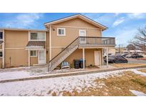 Inviting exterior view of home featuring a quaint balcony and convenient parking at 2281 Coronado Pkwy # D, Denver, CO 80229