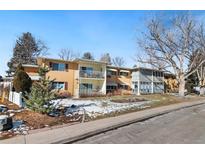 Charming two-story apartment building with balconies and well-maintained landscaping at 705 S Clinton # 2A, Denver, CO 80247