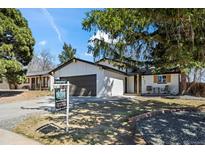 Charming home with a well-maintained yard and a mix of modern and traditional design elements at 8334 Allison Ct, Arvada, CO 80005
