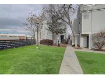 Exterior view of townhouses with landscaped grounds at 11115 E Alameda Ave # 202, Aurora, CO 80012