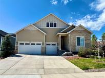Charming two-story home features a stone accent and three-car garage for ample parking at 8440 Rush Creek Ave, Littleton, CO 80125