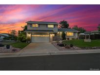 Charming two-story home with a well-manicured lawn and a two-car garage, perfect for a Gathering at 13266 Canopus Dr, Lone Tree, CO 80124