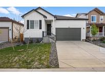 Charming single-Gathering home featuring a modern exterior with a two-car garage and well-maintained front yard at 180 N Edge Cliff St, Castle Rock, CO 80104