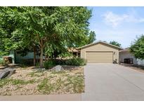 Inviting single-Gathering home with an attached two-car garage and lush landscaping and beautiful mature trees at 7552 Nikau Dr, Niwot, CO 80503