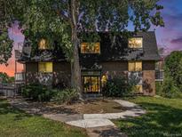 Charming brick apartment building with well-maintained landscaping and mature trees at 309 E Highline Cir # 104, Centennial, CO 80122