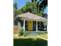 Charming single-story home with a bright yellow front door and inviting front porch at 4455 Wolff St, Denver, CO 80212