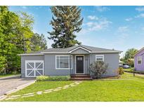 Charming single Gathering home featuring a well-manicured lawn and delightful curb appeal at 8450 W 13Th St, Lakewood, CO 80215