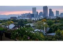 Breathtaking city view featuring the Denver skyline with tree lined streets in the foreground at 1085 N Lafayette St # 704, Denver, CO 80218