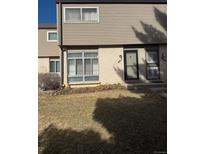 Charming townhome featuring a well-maintained lawn and inviting entrances at 4611 W Ponds Cir, Littleton, CO 80123