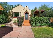 Charming home featuring a beautifully landscaped front yard and eye-catching front entrance with tile steps at 1332 Ash St, Denver, CO 80220