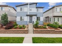 Charming two-story home featuring tasteful landscaping and a welcoming front entrance, perfect for curb appeal at 9682 Dunning Cir, Highlands Ranch, CO 80126