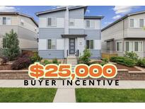 Charming two-story home boasts modern curb appeal with neat landscaping, plus $25,000 buyer incentive at 9682 Dunning Cir, Highlands Ranch, CO 80126