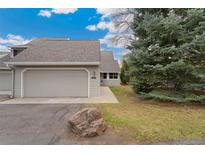 Charming townhouse featuring an attached garage and well-maintained landscaping at 8040 S Culebra Peak, Littleton, CO 80127