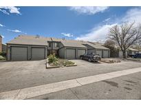 Charming townhomes with a well-maintained exterior and convenient parking at 3596 S Depew St # 2, Lakewood, CO 80235