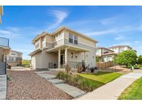 Two-story home with neutral siding, a covered front porch, and a well-maintained front yard at 3692 Celestial Ave, Castle Rock, CO 80109