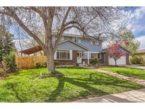 Charming blue two-story home with well-maintained front yard and mature tree at 4707 Ashfield Ct, Boulder, CO 80301