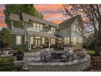 Inviting backyard patio with stone fire pit and outdoor seating, perfect for entertaining and relaxing at 474 W Spruce St, Louisville, CO 80027