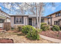 Charming single-story home with manicured landscaping and a welcoming front porch, enhancing curb appeal at 1380 S Fillmore St, Denver, CO 80210