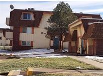 The apartment complex boasts a traditional style and well-maintained landscaping at 10211 Ura Ln # 101, Thornton, CO 80260