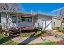 Charming single-story home with a covered front porch, well-maintained lawn, and an attached single car garage at 2777 S Adams St, Denver, CO 80210