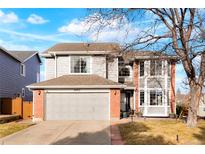 Charming two-story home with a two car garage and a well maintained lawn at 8903 Edgewood St, Highlands Ranch, CO 80130